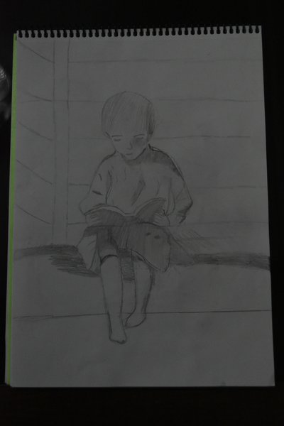 Kitap Okuyan Çocuk